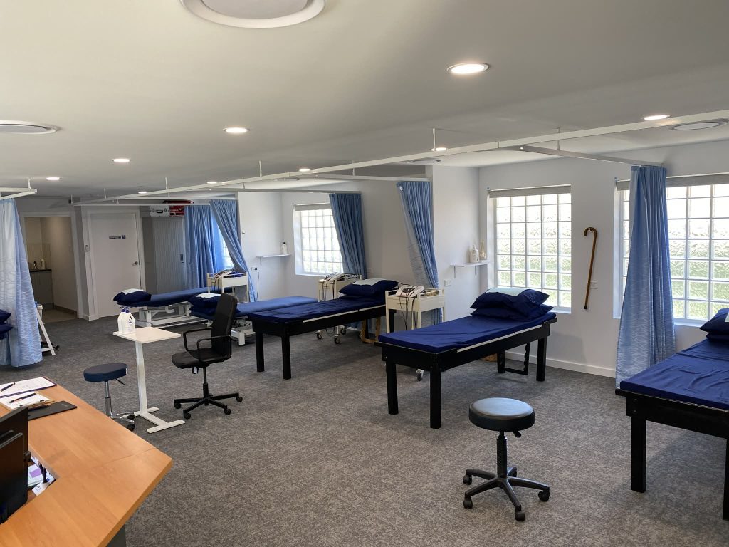 Open treatment room at PPS Physiotherapy Kellyville with multiple treatment beds and rehabilitation space
